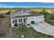One story home featuring a two-car garage, a front yard, and well-maintained landscaping at 15345 Pottstown Ave, Port Charlotte, FL 33981