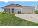 Inviting single-Gathering home with a well-manicured lawn and a welcoming front entrance at 15345 Pottstown Ave, Port Charlotte, FL 33981