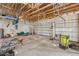 Spacious garage with two doors offering ample storage, featuring a high ceiling with wooden framing, great for projects at 15345 Pottstown Ave, Port Charlotte, FL 33981
