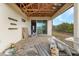 Open patio area with exposed ceiling and sliding glass doors at 15345 Pottstown Ave, Port Charlotte, FL 33981