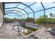 Enclosed pool with screened cage offers outdoor space at 15345 Pottstown Ave, Port Charlotte, FL 33981