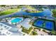 An aerial view of community amenities, including a pool, tennis courts, and a golf course at 1673 Palace Ct, Punta Gorda, FL 33980