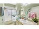 Relaxing bathroom featuring a shower/tub combo, muted green paint, and plants for decoration at 1673 Palace Ct, Punta Gorda, FL 33980