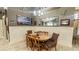 The formal dining area features attractive wainscoting, neutral colors, and wood flooring at 1673 Palace Ct, Punta Gorda, FL 33980