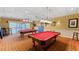 Bright game room featuring two pool tables and plenty of space for recreation at 1673 Palace Ct, Punta Gorda, FL 33980