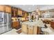 Spacious kitchen boasts granite countertops, stainless appliances, and custom cabinets at 1673 Palace Ct, Punta Gorda, FL 33980