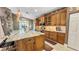 Gourmet kitchen featuring granite island, custom cabinetry, and stainless steel appliances at 1673 Palace Ct, Punta Gorda, FL 33980