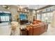 The expansive living room features a modern ceiling fan and stylish decor at 1673 Palace Ct, Punta Gorda, FL 33980