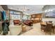 Open concept living space with lots of natural light, including a comfortable living room and kitchen at 1673 Palace Ct, Punta Gorda, FL 33980