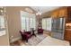 Cozy seating area with bright windows, plantation shutters, and decor at 1673 Palace Ct, Punta Gorda, FL 33980