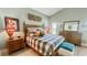 Comfortable main bedroom with ceiling fan, wood floors, and natural light at 1673 Palace Ct, Punta Gorda, FL 33980