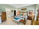 Serene main bedroom with a ceiling fan, ensuite, and a walk-in closet at 1673 Palace Ct, Punta Gorda, FL 33980
