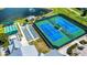 Aerial view of tennis and bocce ball courts, well-maintained and ready for play at 1673 Palace Ct, Punta Gorda, FL 33980