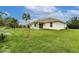 Expansive backyard with well-maintained lawn, offering ample space for outdoor activities and relaxation at 1690 Yakutat Rd, North Port, FL 34287