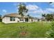 Expansive backyard with lush green grass, ideal for outdoor activities and relaxation at 1690 Yakutat Rd, North Port, FL 34287