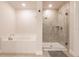 Modern bathroom featuring a glass shower enclosure and a relaxing soaking tub at 1690 Yakutat Rd, North Port, FL 34287