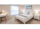 Bright, well-lit bedroom with a cozy bed, desk, and tasteful decorations to create a relaxing space at 1690 Yakutat Rd, North Port, FL 34287