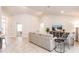 Well-lit living room featuring modern furnishings, neutral tones, and an open layout at 1690 Yakutat Rd, North Port, FL 34287