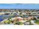 Stunning aerial view of waterfront homes, showcasing their location along canals, nearby bridges, and their proximity to the open water at 1796 Boca Raton Ct, Punta Gorda, FL 33950