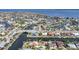 An aerial view displays a desirable waterfront community, with canals and homes with private docks and easy water access at 1796 Boca Raton Ct, Punta Gorda, FL 33950
