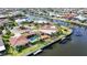 A waterfront property features a private pool and dock, inviting outdoor living, all along a scenic canal at 1796 Boca Raton Ct, Punta Gorda, FL 33950