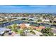 Picturesque aerial view of waterfront homes, canals, and scenic bridges, showcasing the coastal lifestyle at 1796 Boca Raton Ct, Punta Gorda, FL 33950