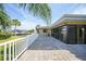 Backyard with lush landscaping, patio space, and canal access, ideal for waterfront living and outdoor enjoyment at 1796 Boca Raton Ct, Punta Gorda, FL 33950