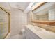 Bathroom with a standup shower, a large vanity, and decorative tiling at 1796 Boca Raton Ct, Punta Gorda, FL 33950