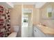Bathroom with a tiled shower and vanity, plus easy access to the bedroom at 1796 Boca Raton Ct, Punta Gorda, FL 33950