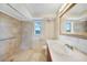 Neutral bathroom with large mirror and walk-in shower at 1796 Boca Raton Ct, Punta Gorda, FL 33950
