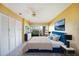 Cozy bedroom with king bed, closet, ceiling fan, and television offering a relaxing space at 1796 Boca Raton Ct, Punta Gorda, FL 33950