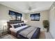 Stylish bedroom featuring natural light, closet, ceiling fan, and calming coastal tones at 1796 Boca Raton Ct, Punta Gorda, FL 33950