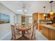 Dining room with a skylight and kitchen view at 1796 Boca Raton Ct, Punta Gorda, FL 33950