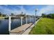 Waterfront property featuring a private dock with access to beautiful canal and nearby residences at 1796 Boca Raton Ct, Punta Gorda, FL 33950