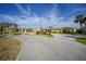 Charming one-story home with a spacious driveway and well-maintained landscaping at 1796 Boca Raton Ct, Punta Gorda, FL 33950