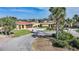 Beautiful one-story home with circular driveway, landscaping, and a two-car garage at 1796 Boca Raton Ct, Punta Gorda, FL 33950