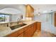 Kitchen with light wood cabinets and granite counters at 1796 Boca Raton Ct, Punta Gorda, FL 33950