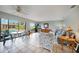 Comfortable living area with tile flooring, and views of the pool area enhancing indoor-outdoor living at 1796 Boca Raton Ct, Punta Gorda, FL 33950