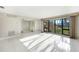Bright living room with large windows and tile flooring at 1796 Boca Raton Ct, Punta Gorda, FL 33950