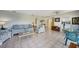 Open living room with tile floors, neutral walls, and comfortable seating, great for entertaining at 1796 Boca Raton Ct, Punta Gorda, FL 33950