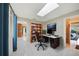 Well-lit office space featuring desk, bookcase, and skylight with easy access to the bedroom and kitchen at 1796 Boca Raton Ct, Punta Gorda, FL 33950