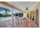 Inviting covered patio with tiled flooring overlooking the pool, perfect for outdoor relaxation and entertaining at 1796 Boca Raton Ct, Punta Gorda, FL 33950