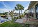 Inviting waterfront view with lush landscaping, a paver walkway and direct canal access at 1796 Boca Raton Ct, Punta Gorda, FL 33950