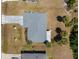 Overhead view of the home showcasing the roof, landscaping, driveway, and the surrounding yard at 18151 Cochran Blvd, Port Charlotte, FL 33948