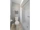 Bathroom with a classic white toilet and shower stall at 18151 Cochran Blvd, Port Charlotte, FL 33948