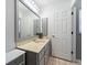 Well-lit bathroom vanity featuring ample storage space and neutral color palette at 18151 Cochran Blvd, Port Charlotte, FL 33948