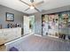 Bedroom with modern gray walls and decor and a closet with shelving at 18151 Cochran Blvd, Port Charlotte, FL 33948