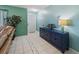 Stylish foyer with decorative cabinet, complemented by tile flooring and natural lighting at 18151 Cochran Blvd, Port Charlotte, FL 33948