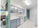 Bright kitchen featuring modern appliances, ample cabinet space, and an adjacent living area view at 18151 Cochran Blvd, Port Charlotte, FL 33948