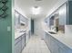 Well-lit kitchen featuring ample countertop space, modern appliances, and tile flooring at 18151 Cochran Blvd, Port Charlotte, FL 33948
